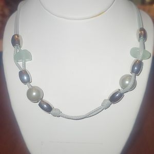 Long necklace with gold and teal accents